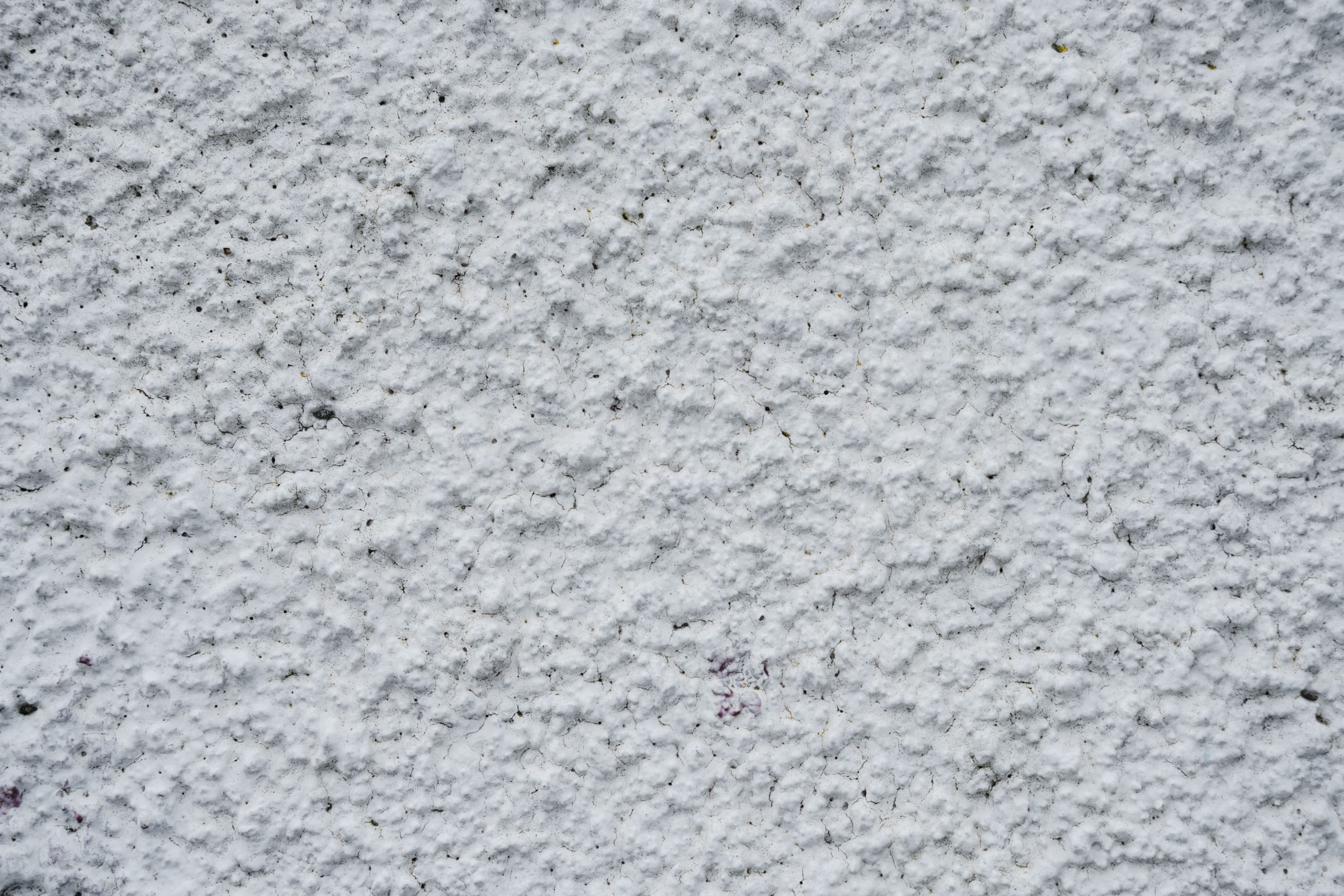 Mur texturé blanc de vieux bâtiment